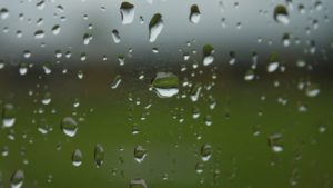 A window with water droplets on it.