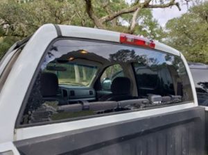 A truck with its windows open and the back of it.